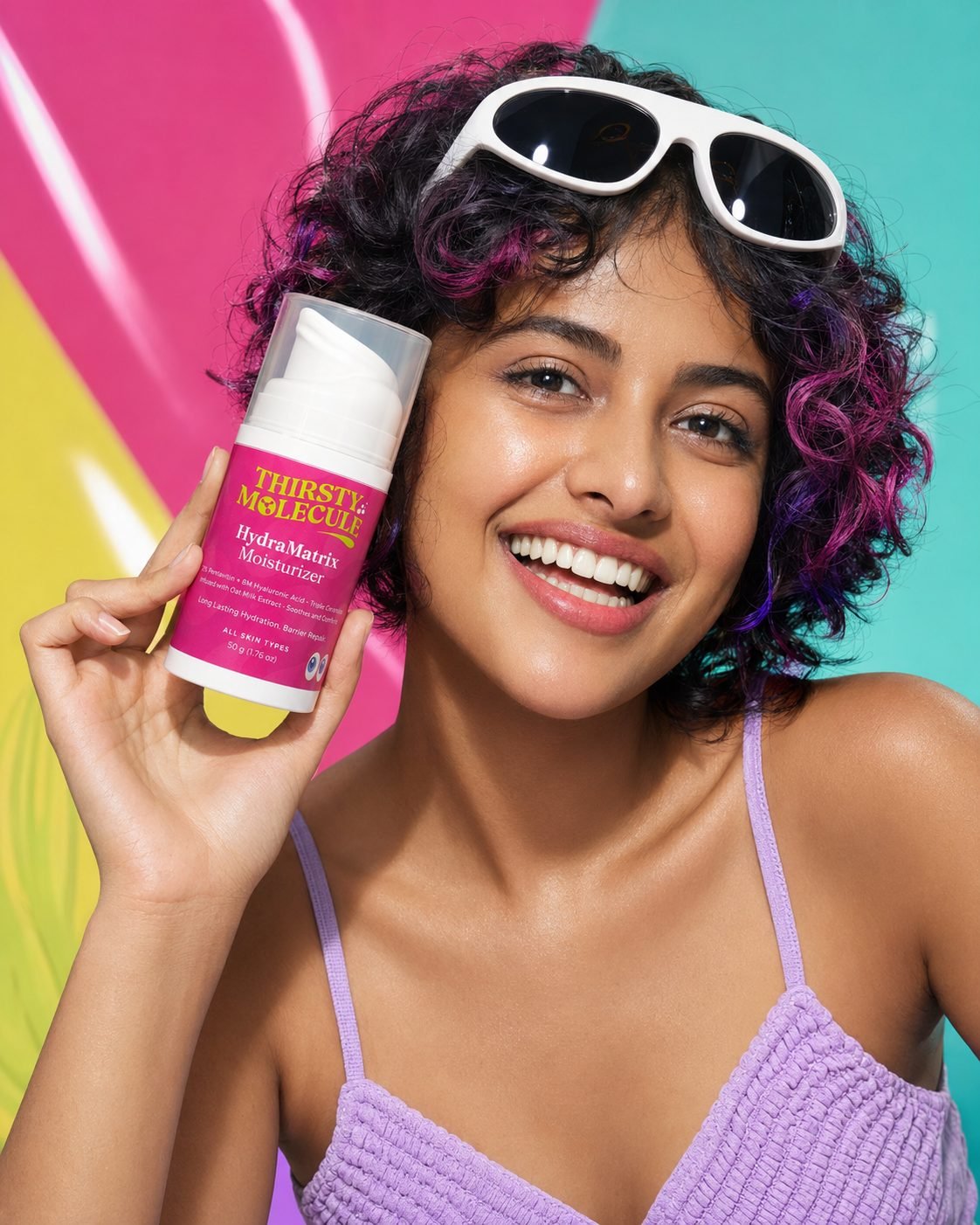 Joyful woman holding HydraMatrix moisturizer